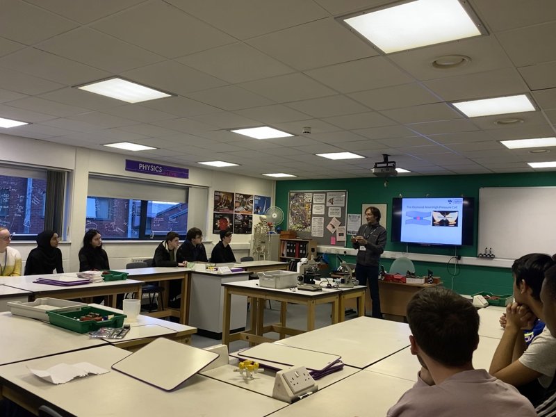 Students at Ashton-under-Lyme sixth form college learning about modern high pressure research and seeing the diamond anvil high pressure cells.