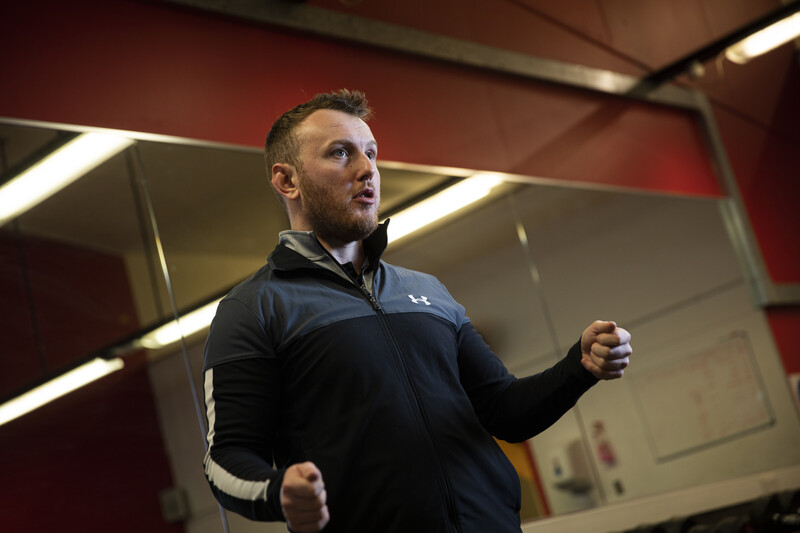 a talk being given in a gym/sports room