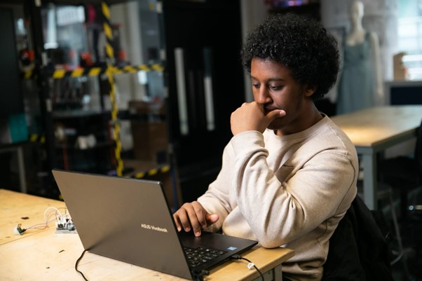 Man working on a laptop.