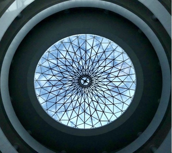 A circular glass dome adorned with a decorative circular pattern