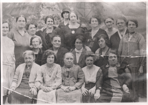 Photograph of a group of women posed for the camera for an outing