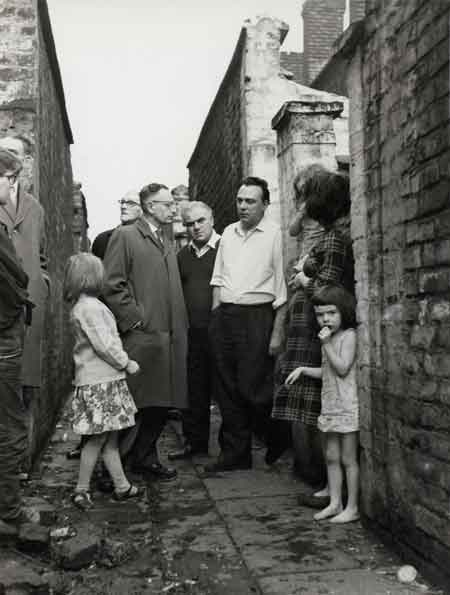 Frank Allaun MP, meeting with residents in an alley